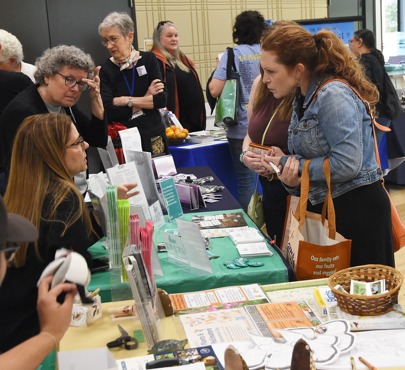 People sharing resources at a community outreach event.