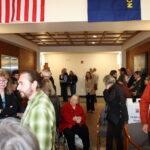 People mingle in the lobby of the Benton County Barbara Ross building.