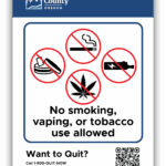 Benton County's Smoke-, Vape-, and Tobacco-free Properties sign with Oregon Tobacco Quit Line info.