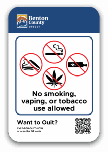 Benton County's Smoke-, Vape-, and Tobacco-free Properties sign with Oregon Tobacco Quit Line info.
