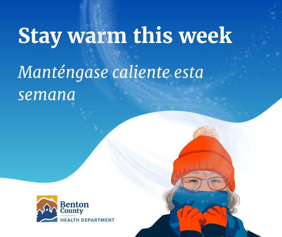 Person wearing an orange winter hat and gloves facing snowy hills under a blue sky with 'Stay warm this week' message.
