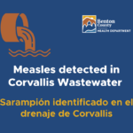 An illustration of a sewage pipe announcing the detection of measles in Corvallis wastewater.