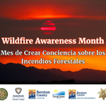 Sunset in smoky air over mountain silhouettes with text promoting Wildfire Awareness Month in English and Spanish.