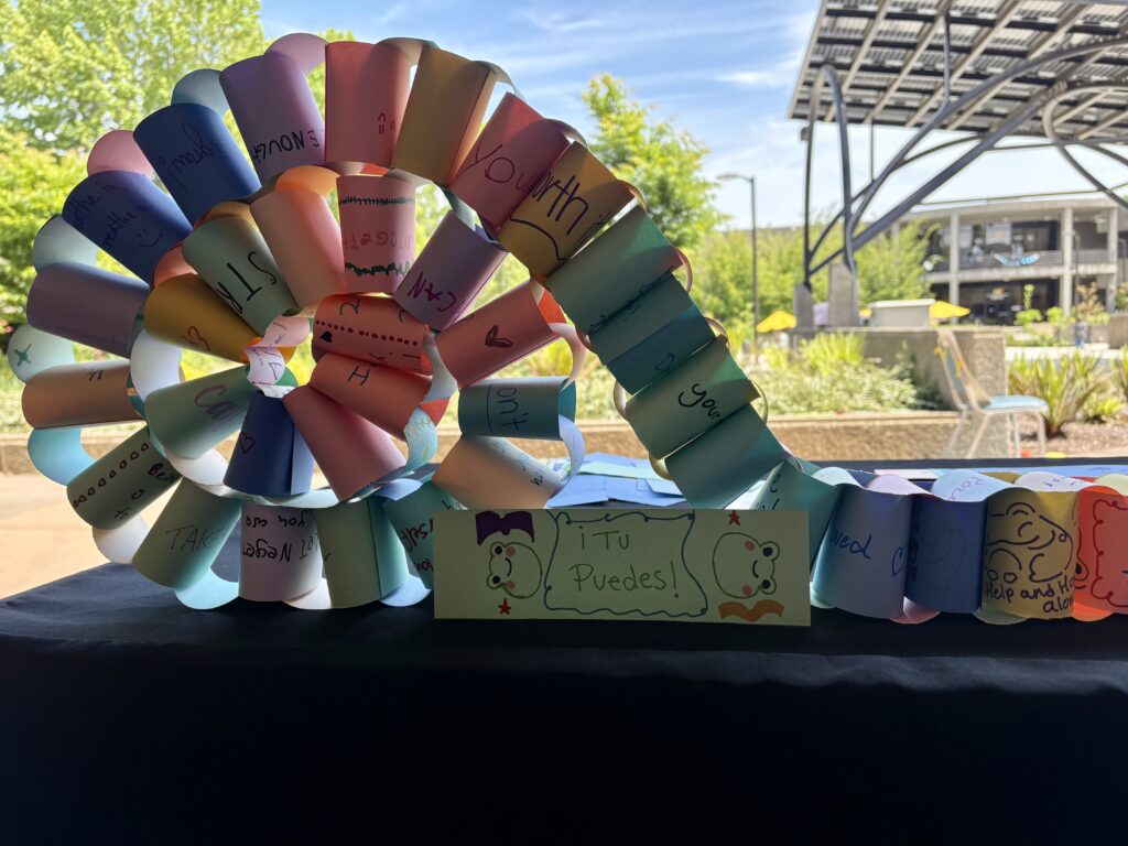 A rainbow-colored paper chain with inspirational messages on each link that will be displayed at the Benton County Crisis Center. Community members each made a link to add to the chain during resource events throughout May.