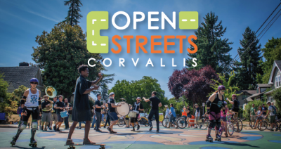 People on skateboards, roller blades, and bikes surrounding musicians in the middle of the street.